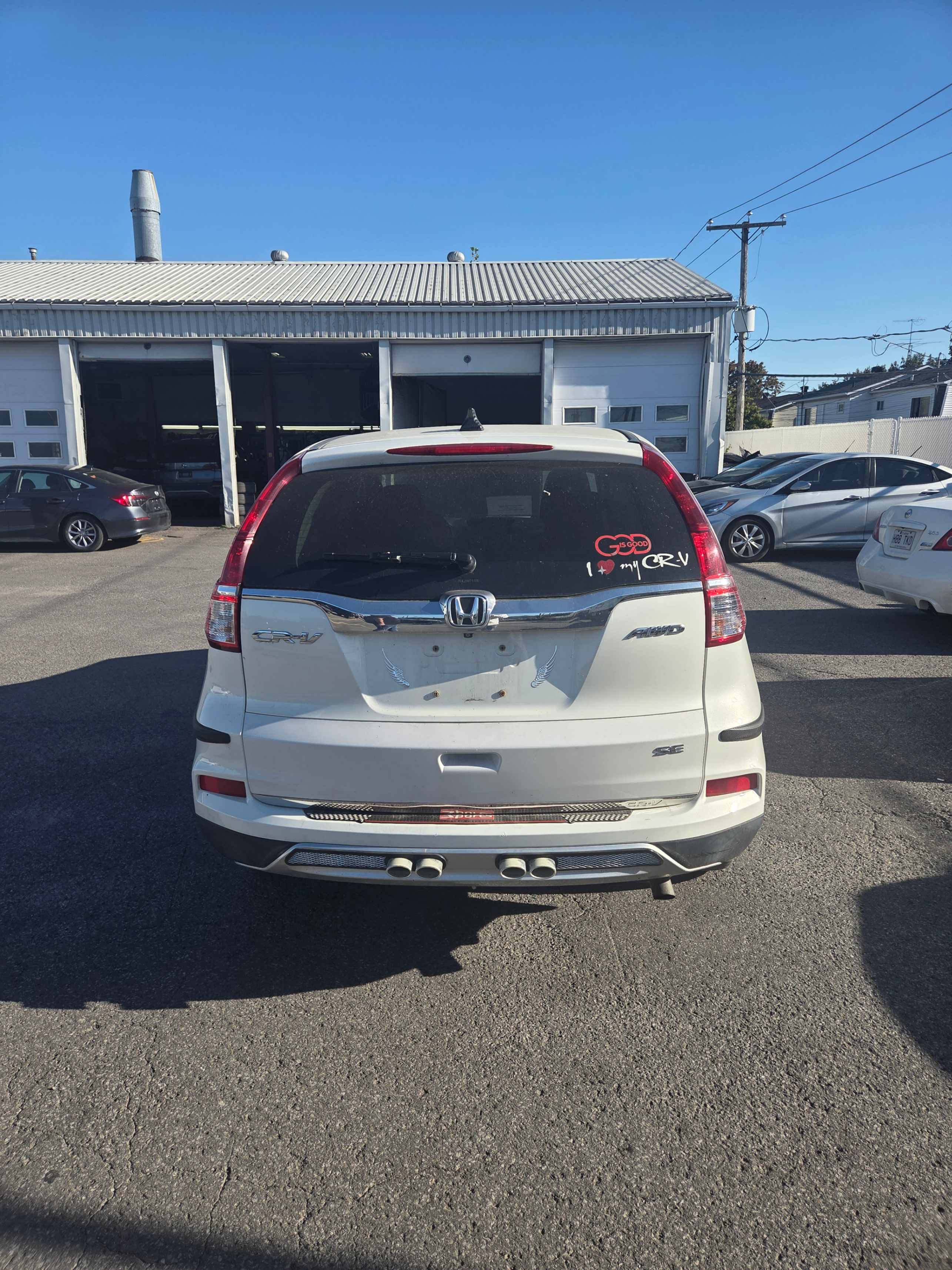 Photo 4 from auction – 2015 HONDA CR-V SE with VIN 2HKRM4H45FH125064