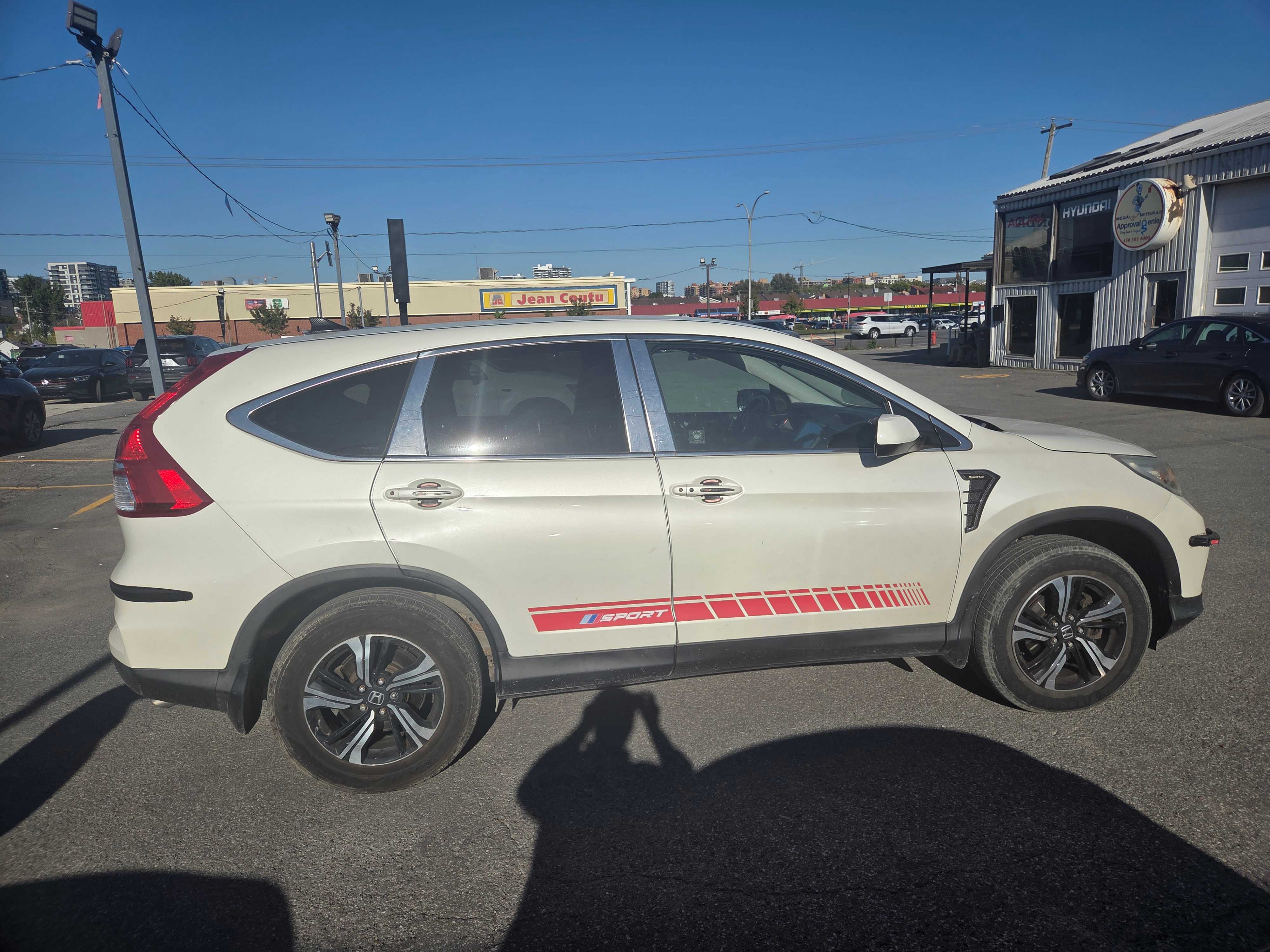 Photo 3 from auction – 2015 HONDA CR-V SE with VIN 2HKRM4H45FH125064