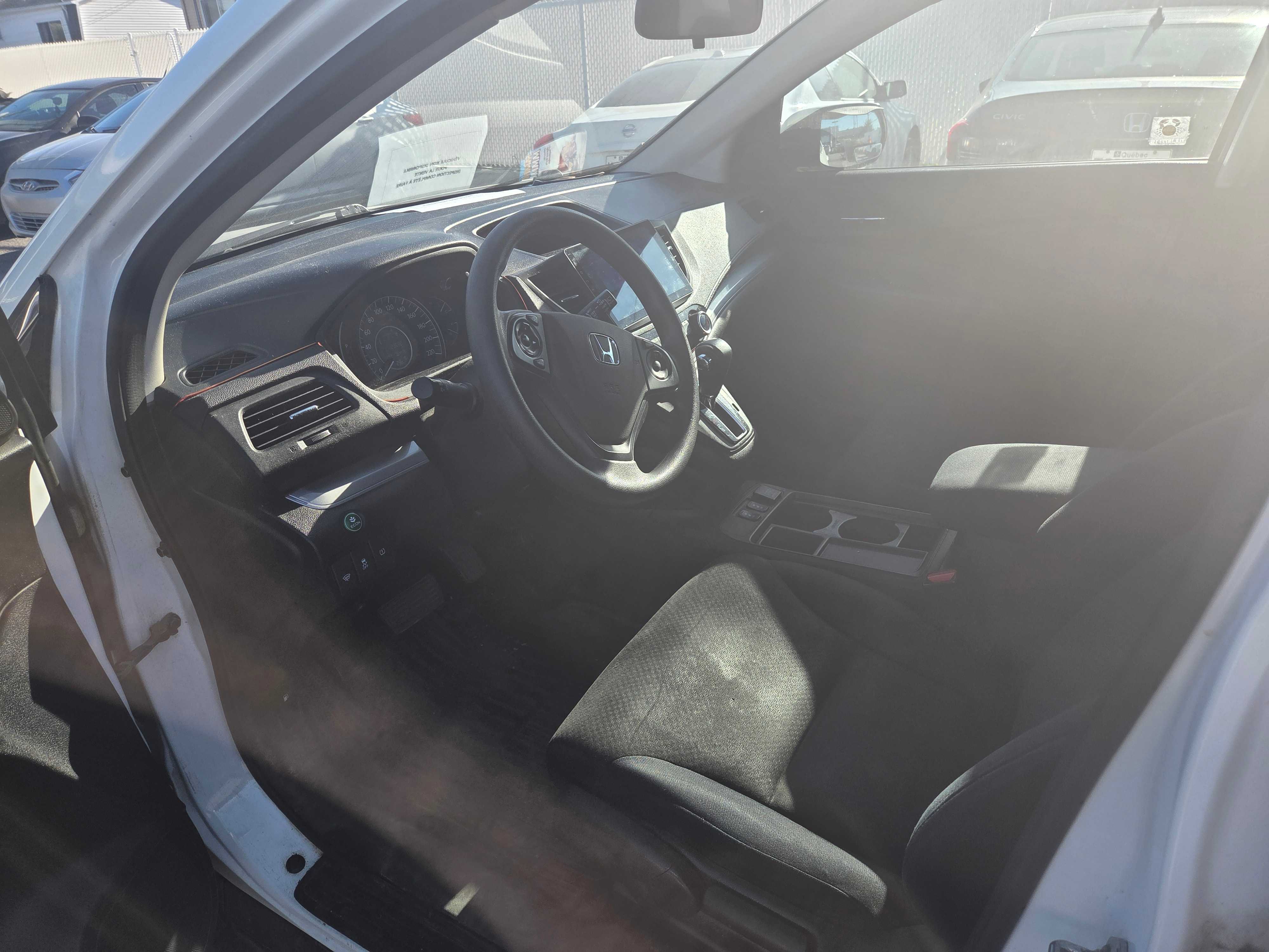 Photo 5 from auction – 2015 HONDA CR-V SE with VIN 2HKRM4H45FH125064